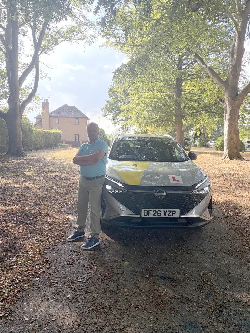 Maurizio with his dual-control driving-school car